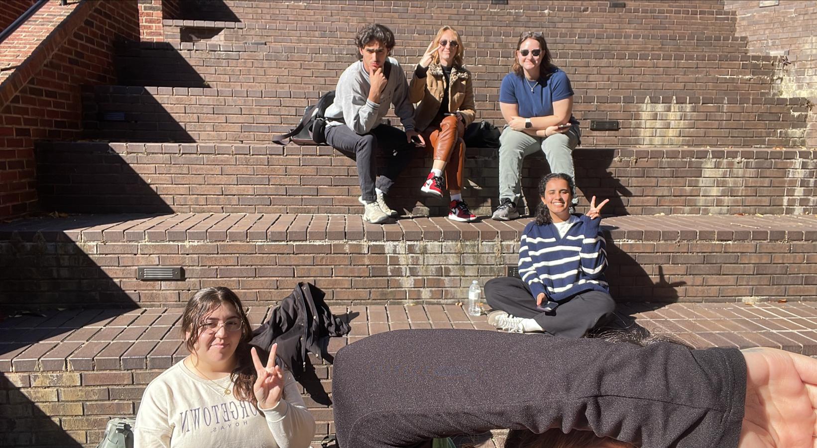 Angie Wright poses with her friends on the steps below Red Square.