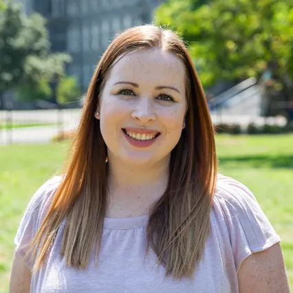 Headshot of Stephanie Gage in front of Healy Lawn.
