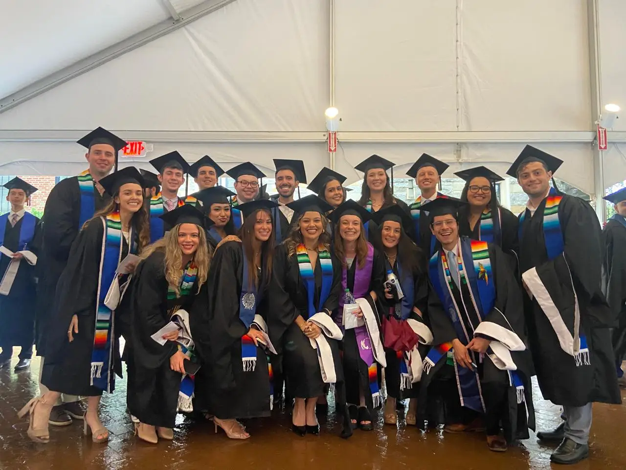Group photo of Latin American studies 20242 graduates in graduation regalia.
