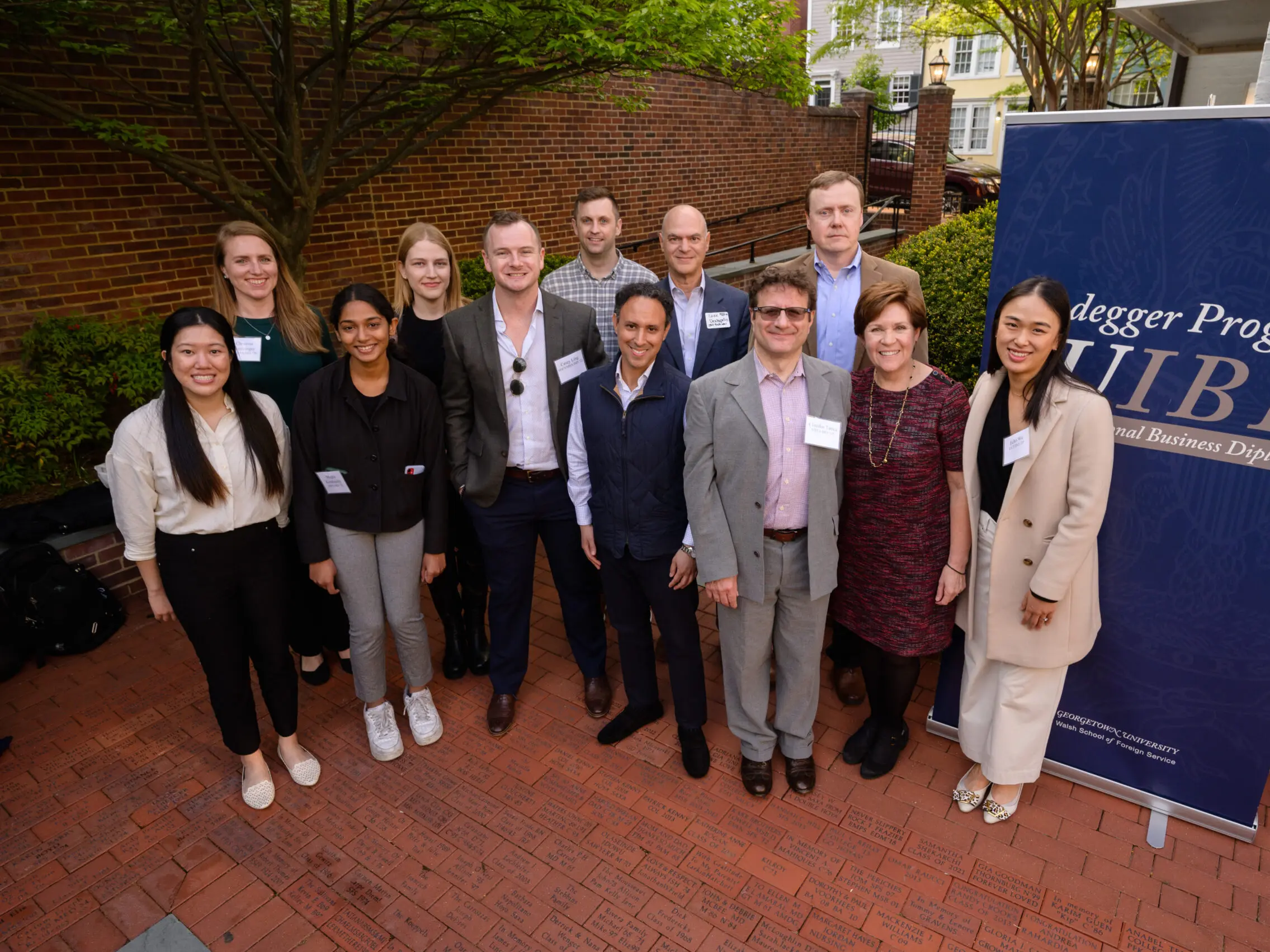 Group photo of International Business Diplomacy students at a reception.
