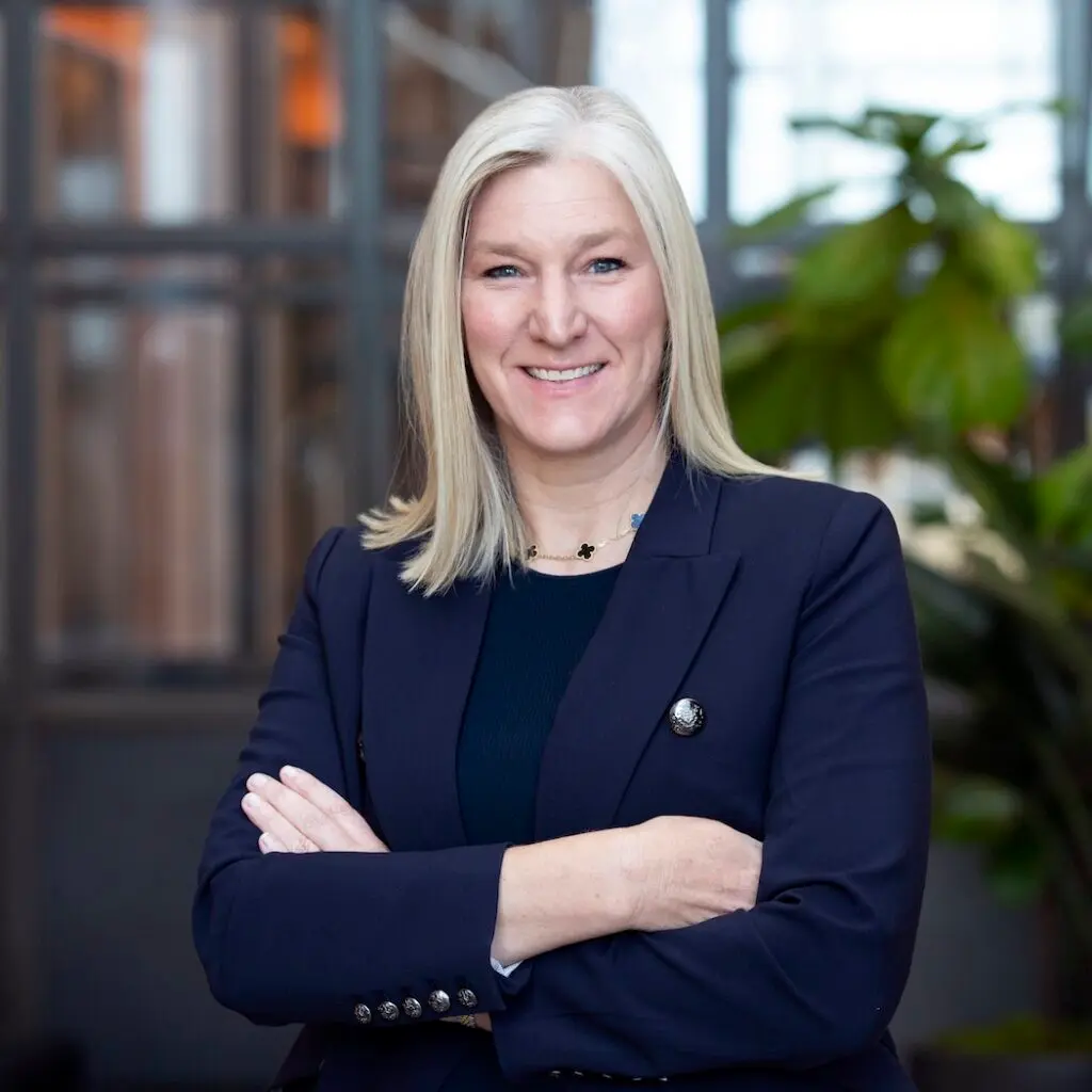 Katrina O'Connell wearing a navy blue suit.