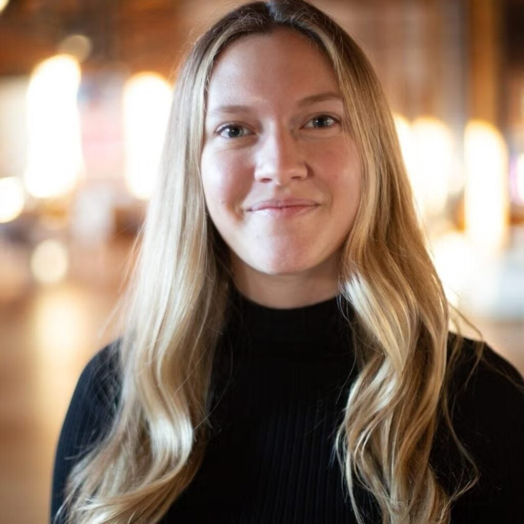 Zoe Borden in a long sleeve black turtleneck shirt.