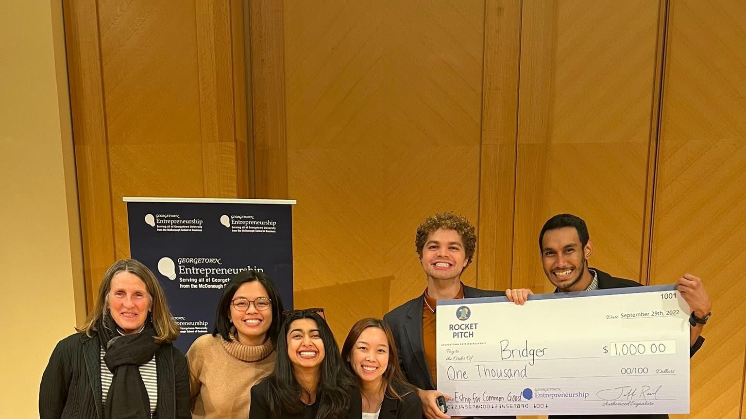 Photo of GHD students holding their award.