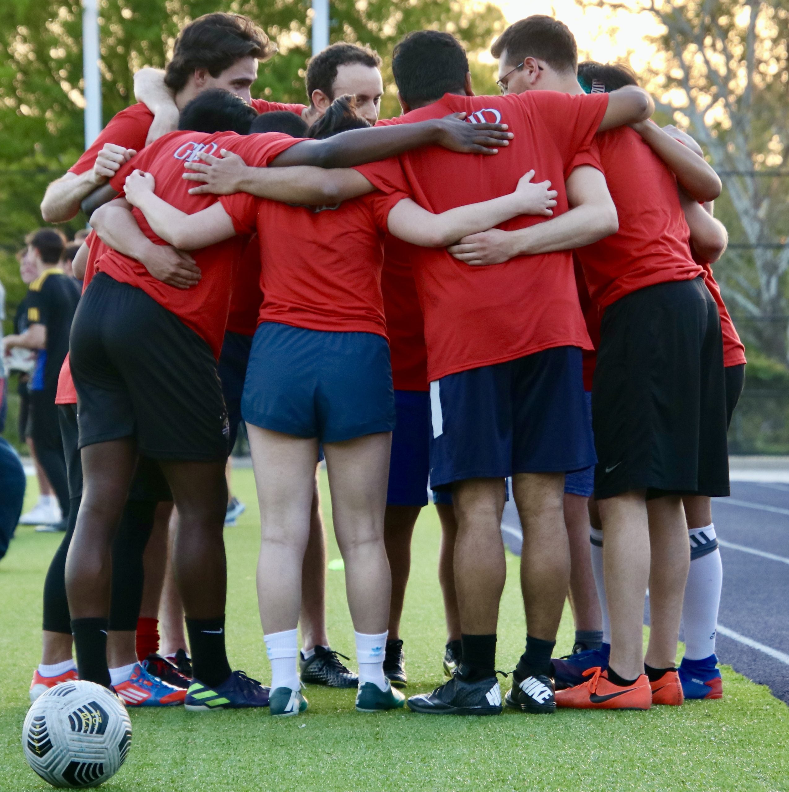 Photo of Solow No' Mo' huddling up before the game.