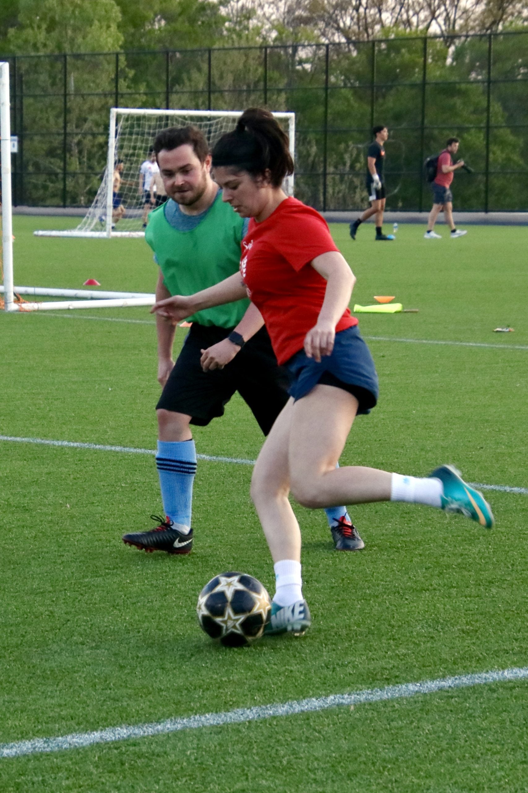 Photo of a GHD student hitting a football.