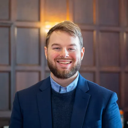 Headshot of Jacob Mendel, smiling.