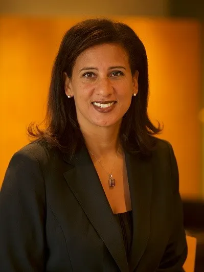 Headshot of Nicole Bibbins Sedaca, smiling.