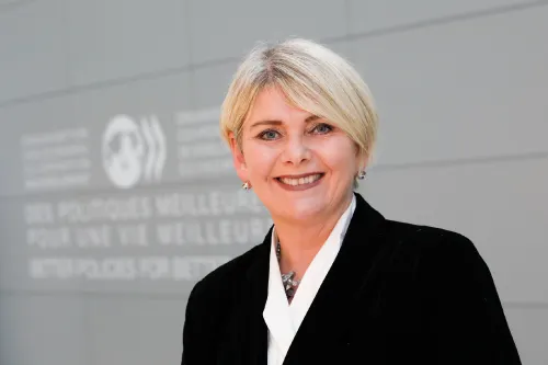 Headshot of Ragnheiður Elín Árnadóttir, smiling.