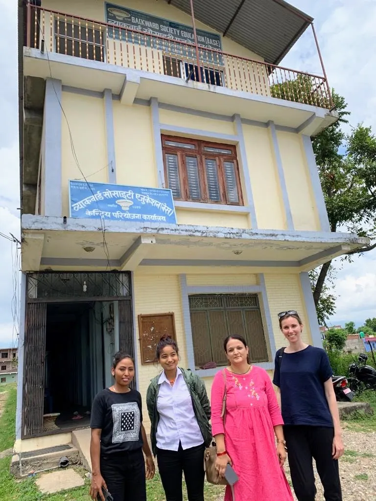 Therese at the BASE office with three other people.