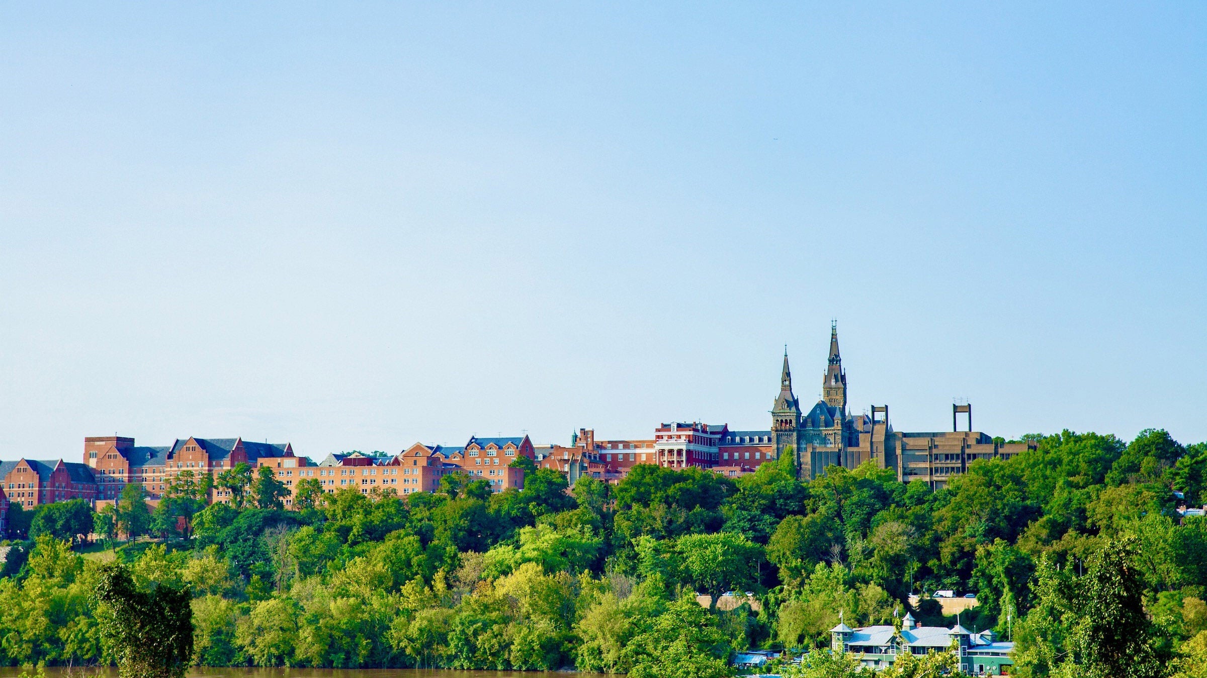 Georgetown University campus shot from the Potomac river in the summer, on a sunny day