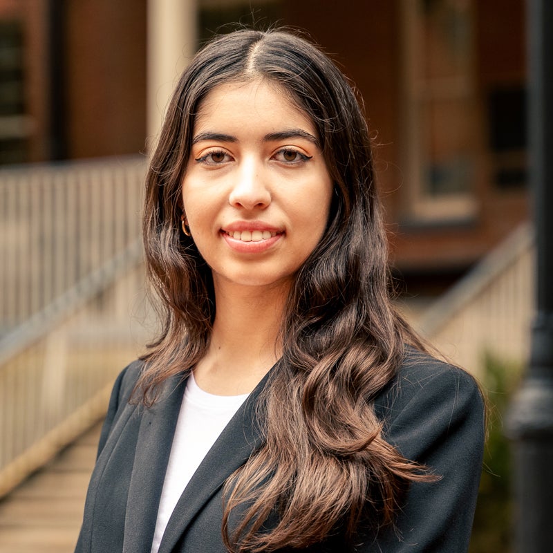 Headshot of a smiling Alexandra HAMILTON in business clothing