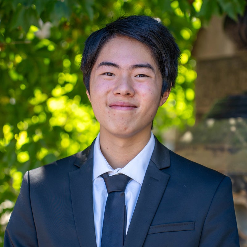 Headshot of Jeremy SUZUKI wearing a suit