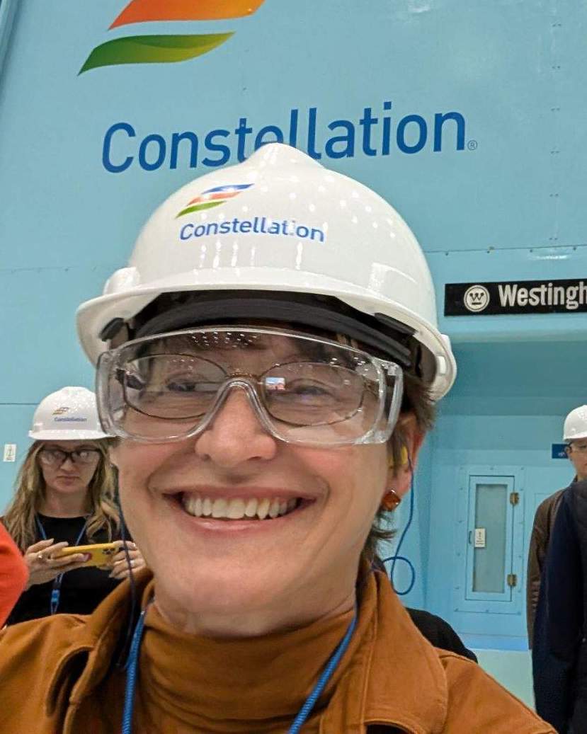 Professor Theresa Sabonis-Helf smiling, wearing a safety helmet and goggles