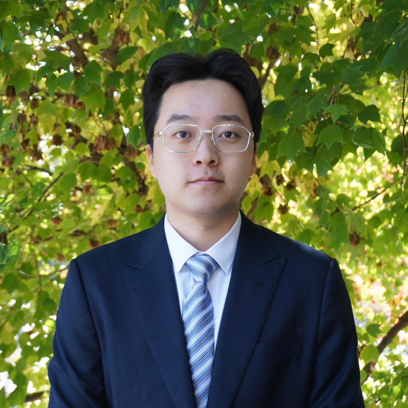 Headshot of Danny Liu wearing business attire