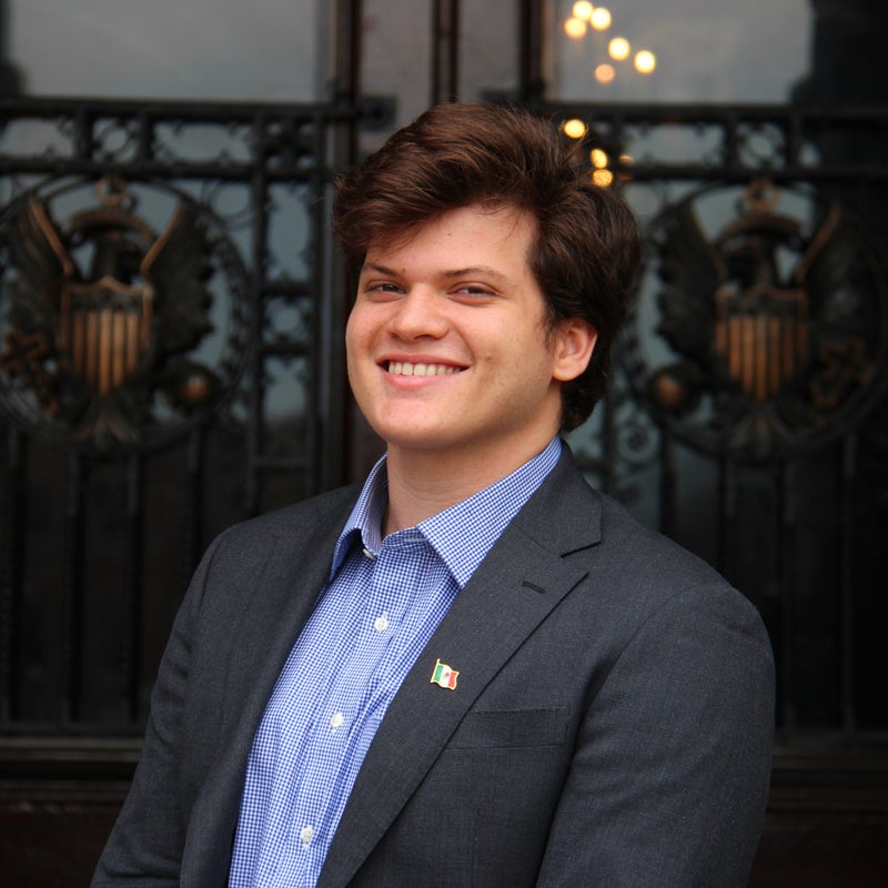 Headshot of Francisco Barnes smiling wearing business attire
