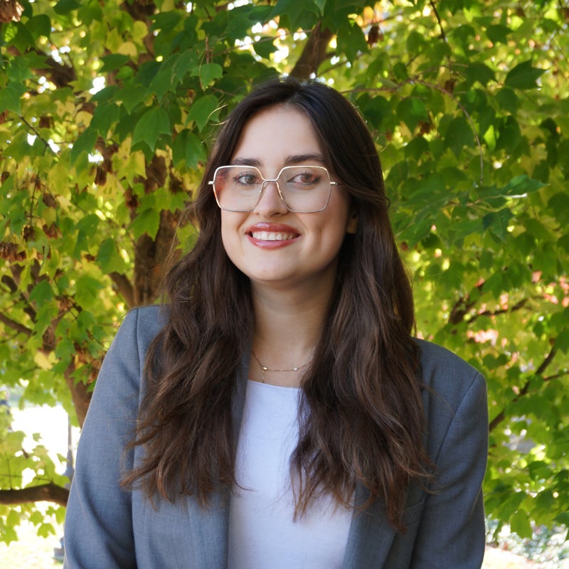 Headshot of Ophelia Bentley smiling wearing business attire