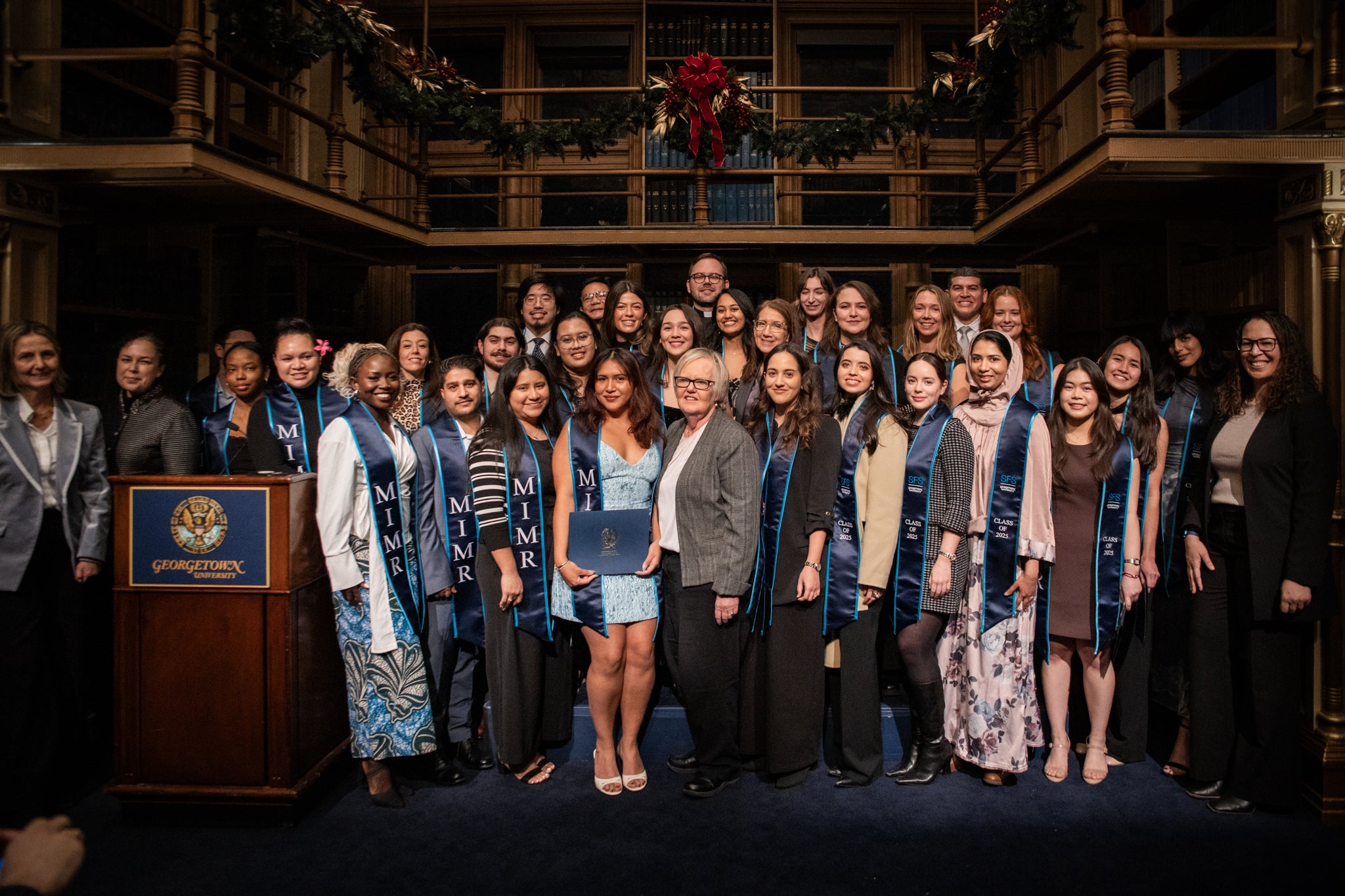 Group photo of MIMR students and faculty at the graduate reception.