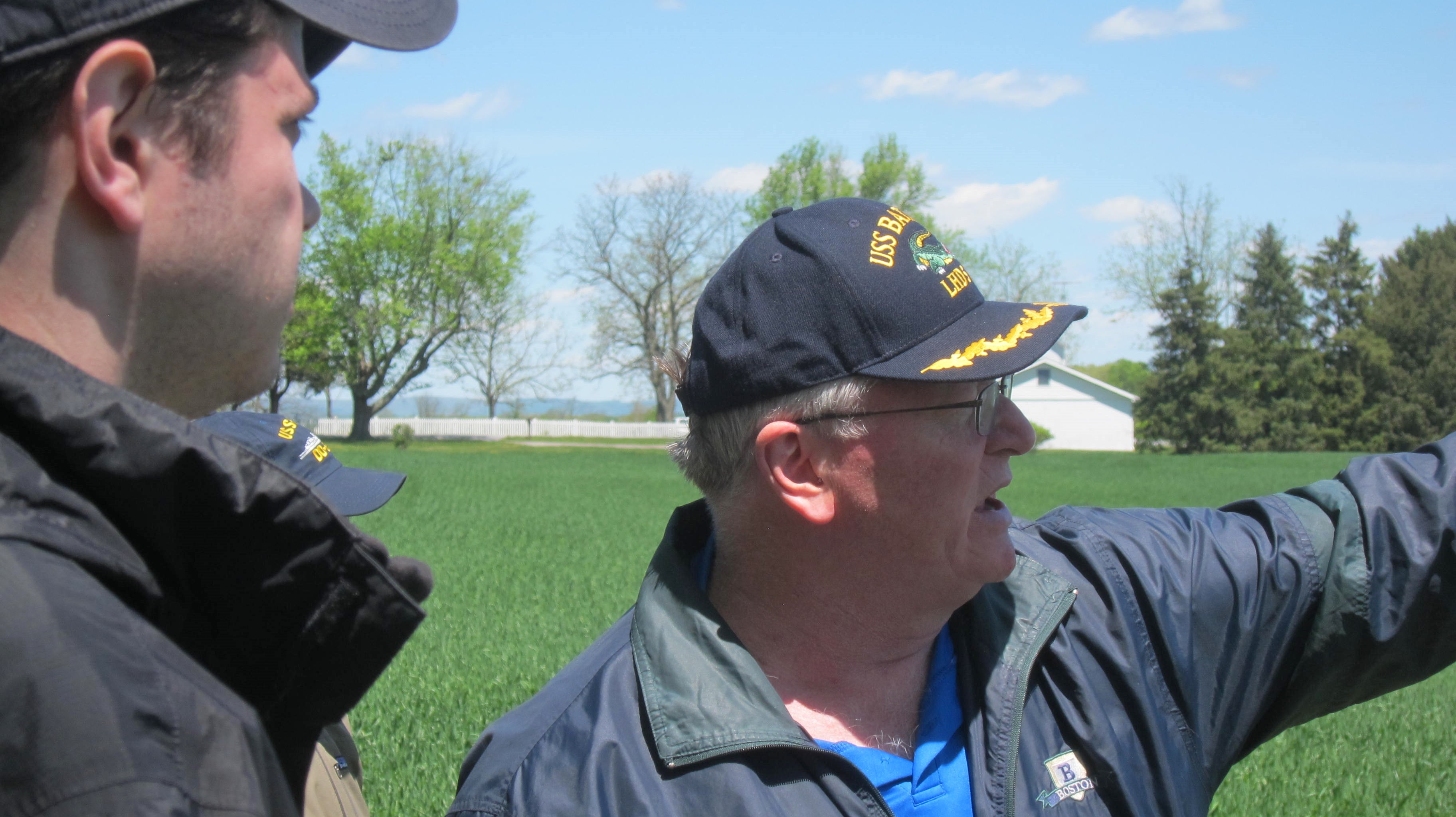 Professor Gordon wearing a navy cap looking into the distance at Gettysburg